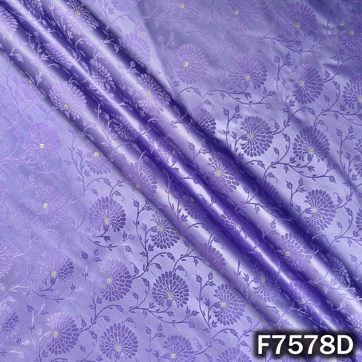 Draped lavender brocade fabric with subtle woven florals