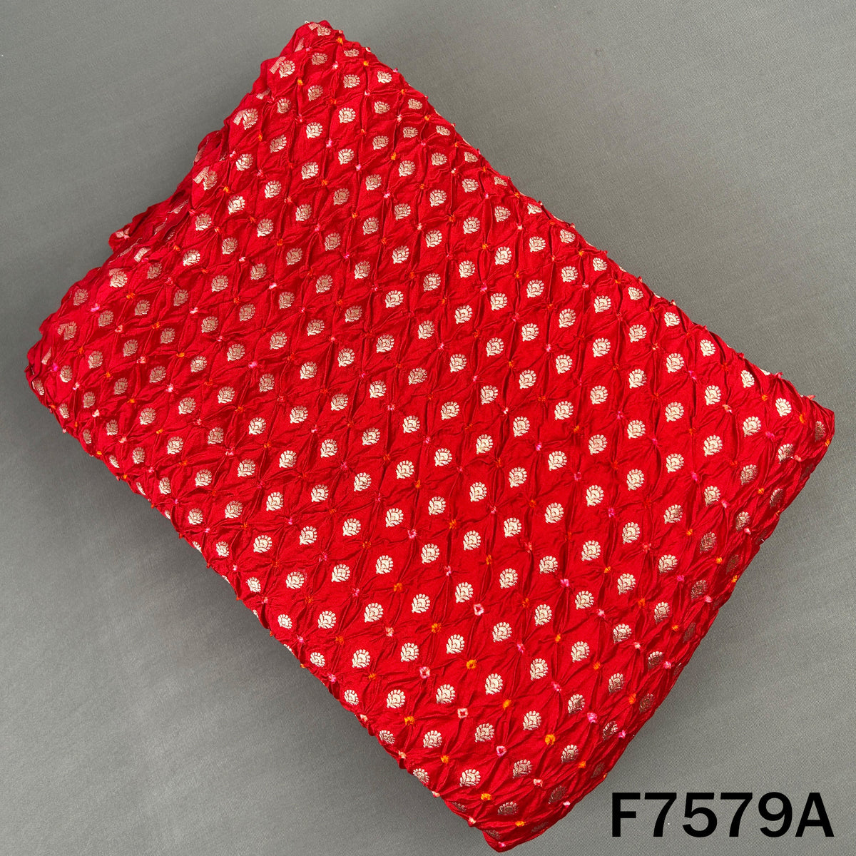 Red Bandhani silk fabric with golden zari motifs