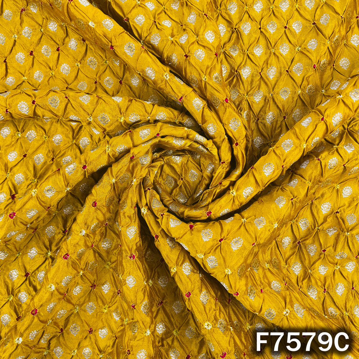 Draped yellow Bandhani silk with traditional zari motifs