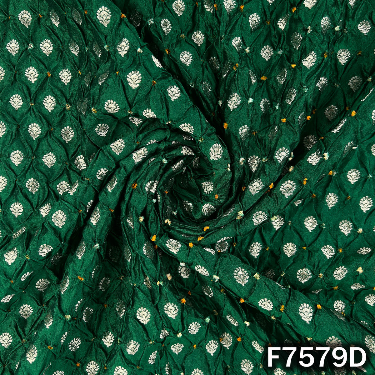 Draped green Bandhani silk with woven golden motifs