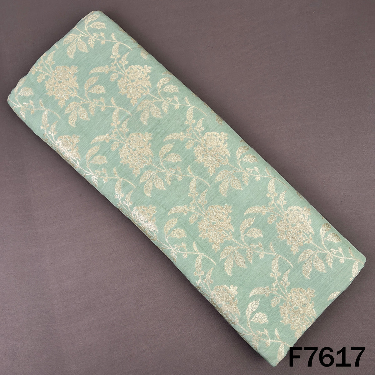 Mint green Monga silk fabric with golden zari floral vines