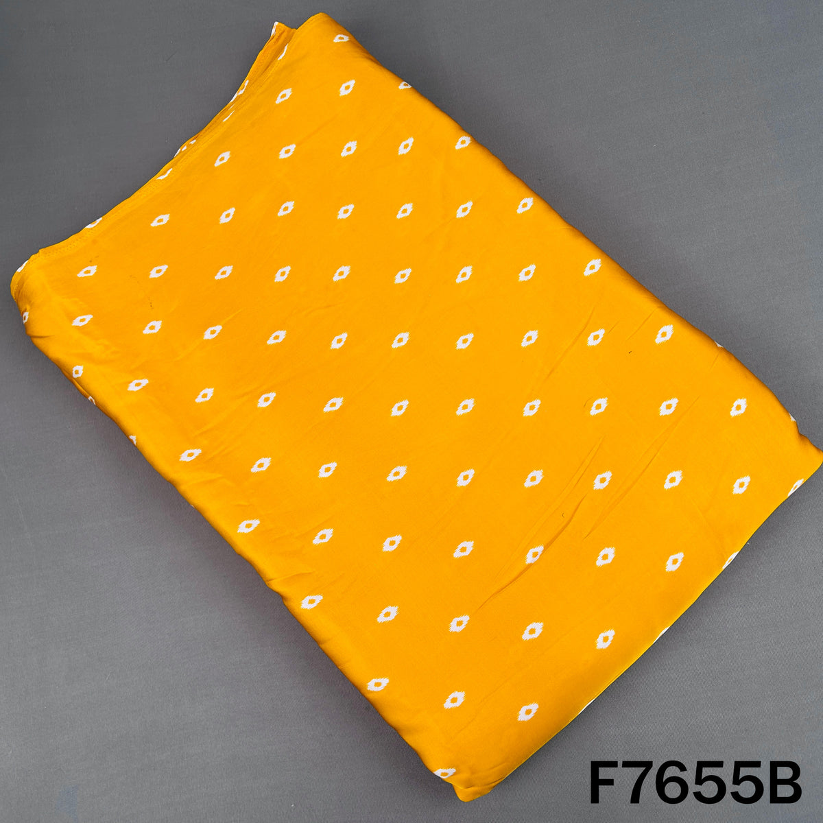 Yellow modal satin bottom fabric with small white dotted motifs