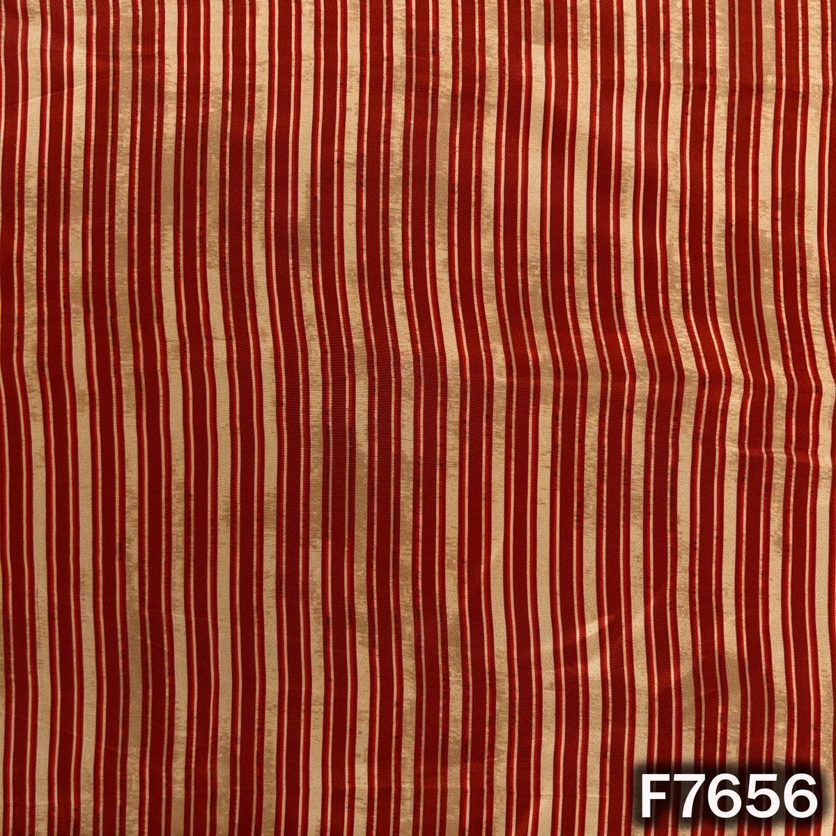 Rust orange crepe fabric featuring classic cream stripe pattern