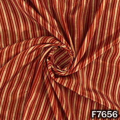 Draped rust orange crepe fabric with elegant vertical stripes