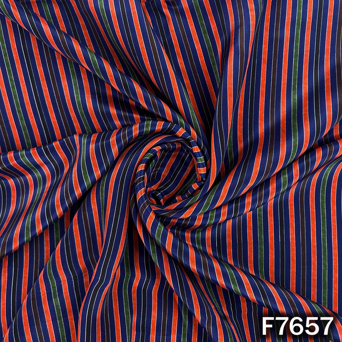 Draped navy blue crepe fabric with vibrant multicolor stripe pattern