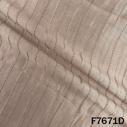 Draped beige Monga silk with fine linear embroidery