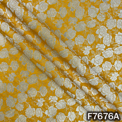 Draped yellow brocade fabric with floral zari weaving