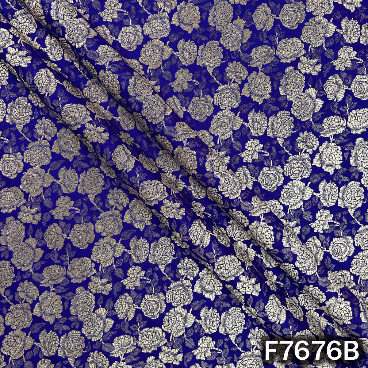 Draped royal blue brocade with woven zari roses