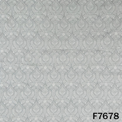 Ivory raw silk fabric with intricate tone-on-tone floral motifs