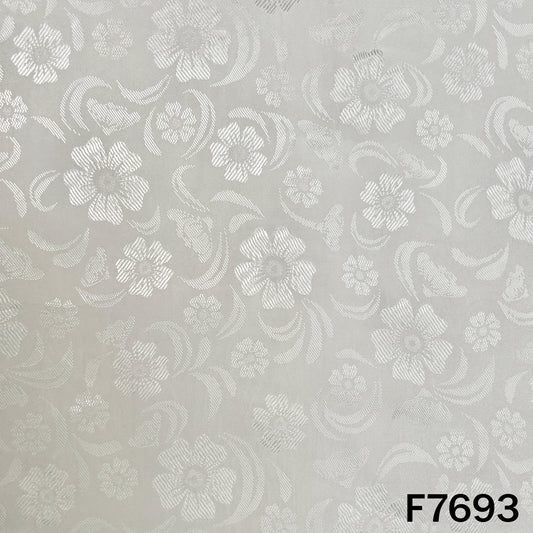 White crepe fabric with intricate self woven floral motifs