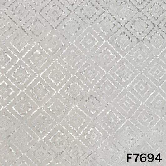 White crepe fabric with repeating self woven diamond motifs