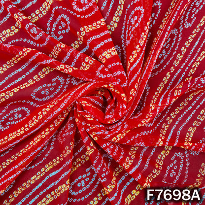 Draped red georgette with white Bandhani paisley motifs