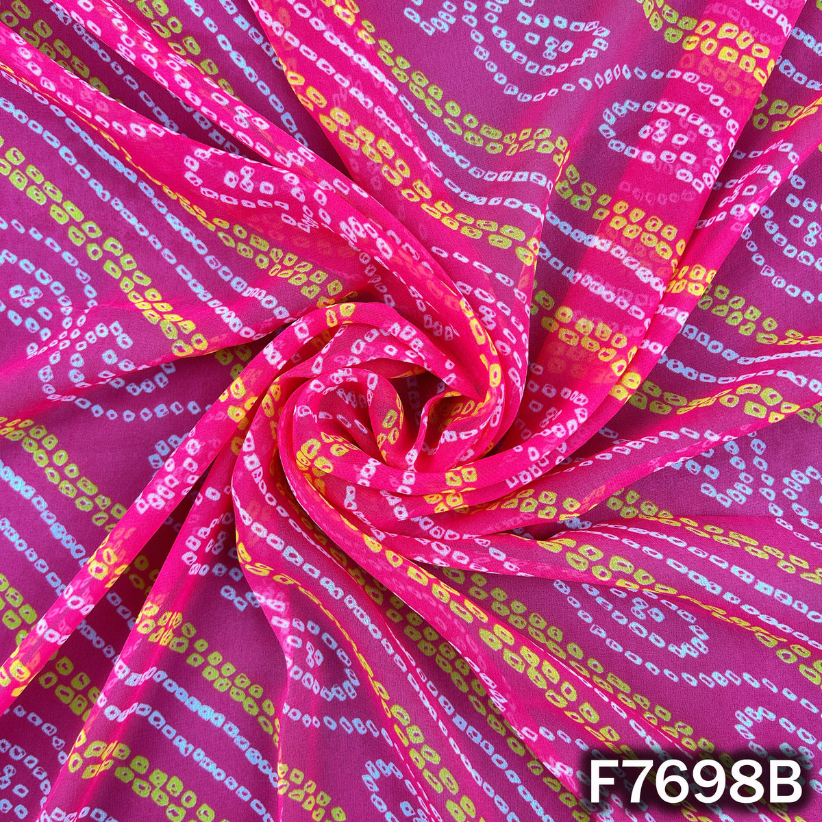 Draped pink georgette with traditional tie dye patterns