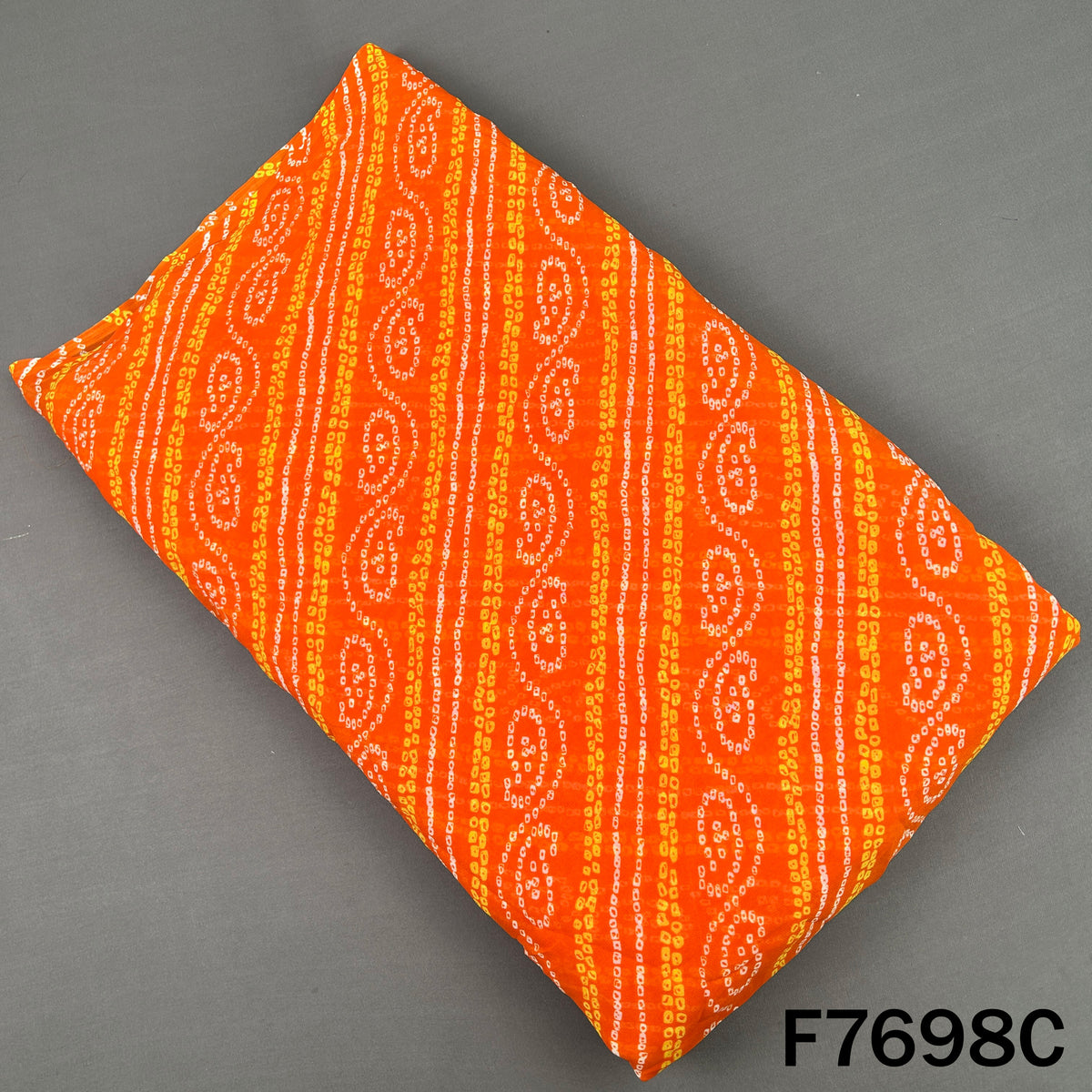 Orange georgette fabric with white Bandhani paisley motifs