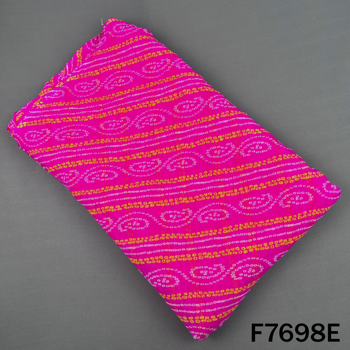 Magenta georgette fabric with colorful Bandhani paisley patterns