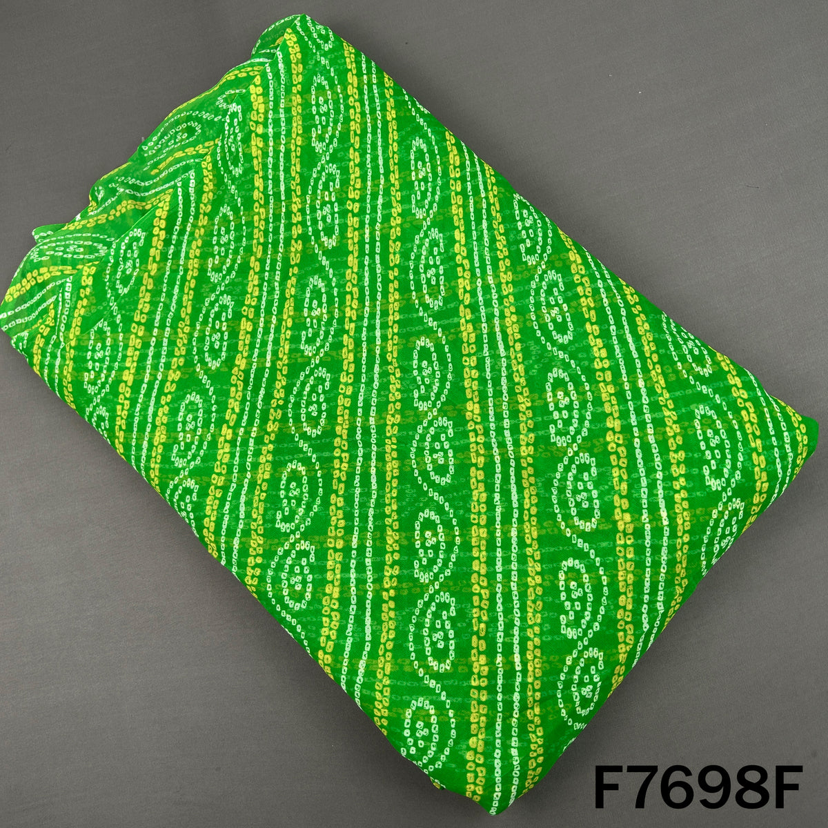 Bright green georgette fabric with yellow Bandhani patterns