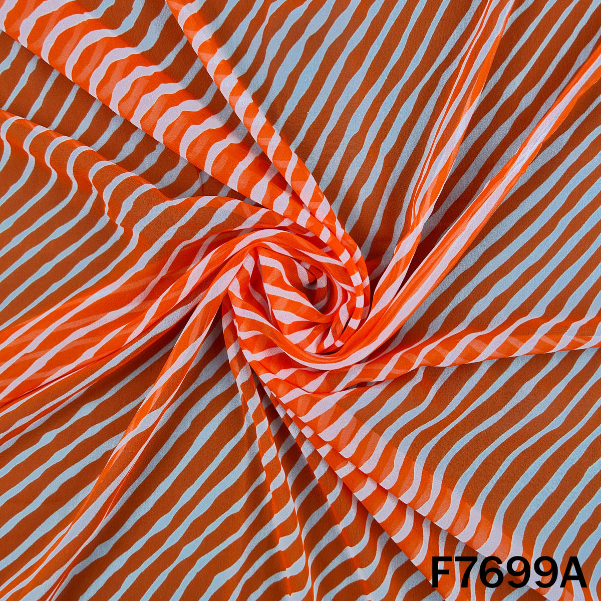 Draped orange georgette with traditional striped wave pattern