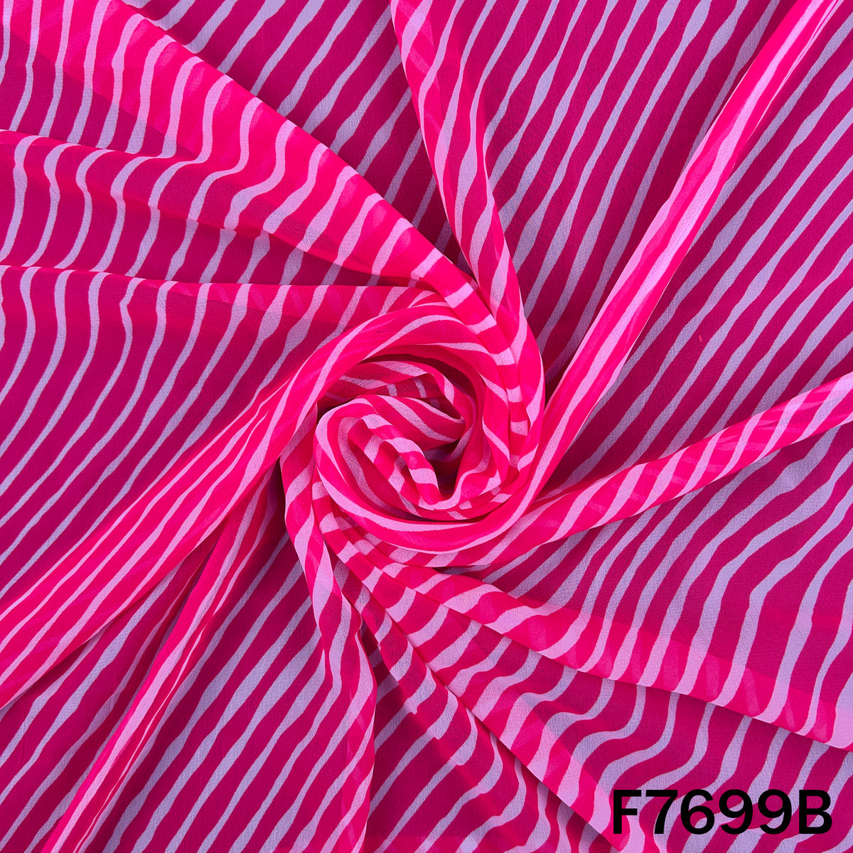 Draped pink Laheriya georgette with flowing white stripes