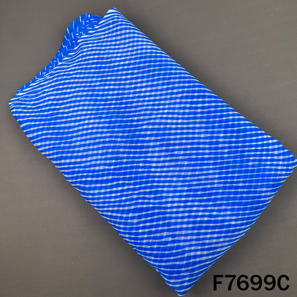 Royal blue georgette fabric with white Laheriya stripes