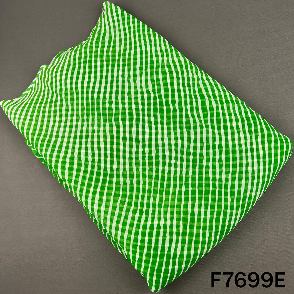 Bright green georgette fabric with white Laheriya stripes