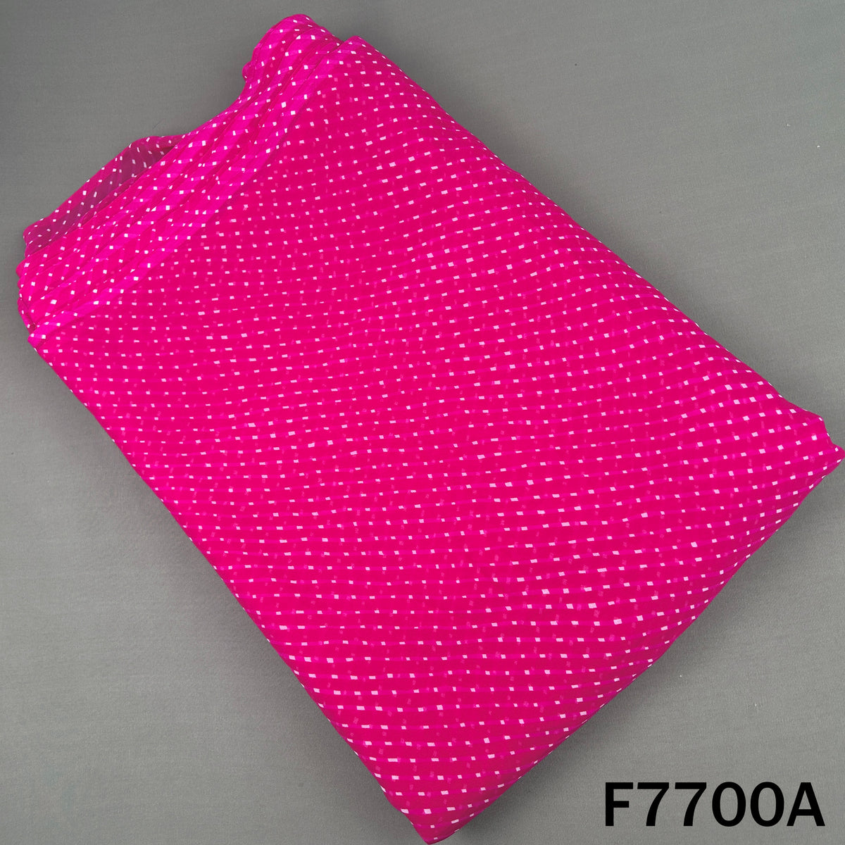 Rani pink georgette fabric with dotted Laheriya stripes