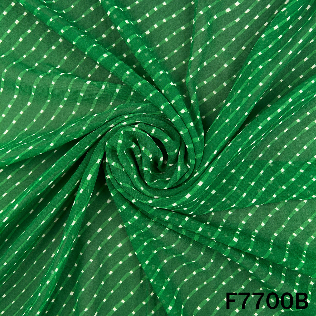 Draped green georgette fabric with traditional Laheriya pattern