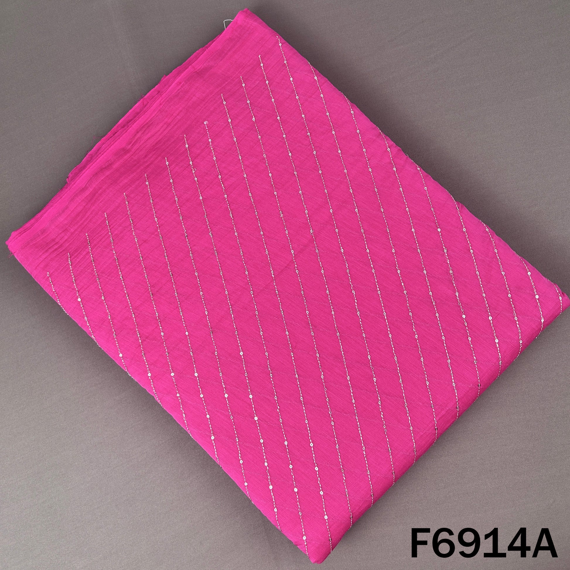 F6914A hot pink Mul Chanderi top fabric designed with fine zari lines and subtle sequins sparkle