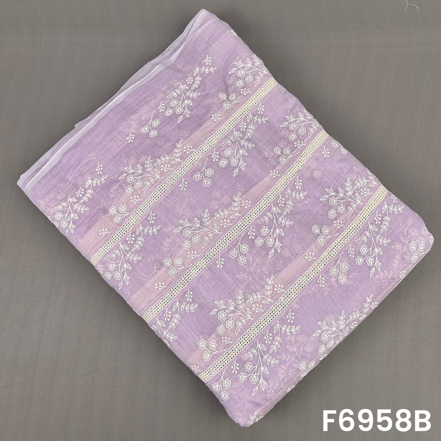 Lavender Mul Chanderi fabric F6958B featuring graceful white botanical motifs arranged between decorative bands