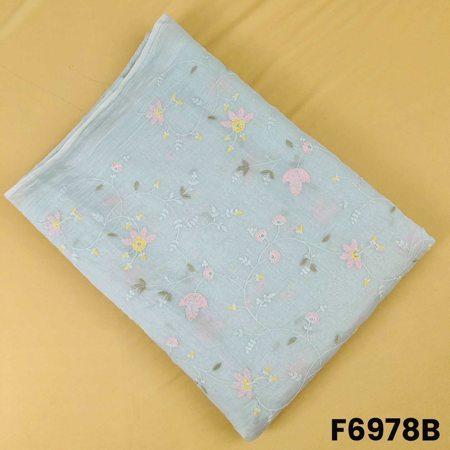 Mint green Mul Chanderi fabric F6978B decorated with soft floral motifs and refined sequins detailing