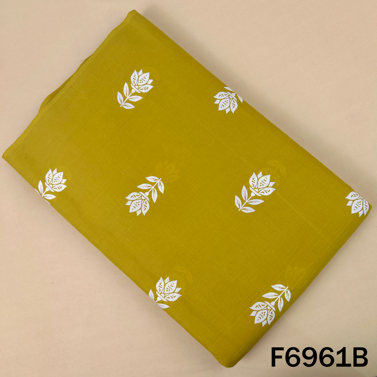 F6961B mustard Printed Cotton fabric designed with small white floral buti motifs