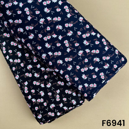 Navy printed rayon fabric F6941 with small blush pink floral sprigs and soft white botanical accents