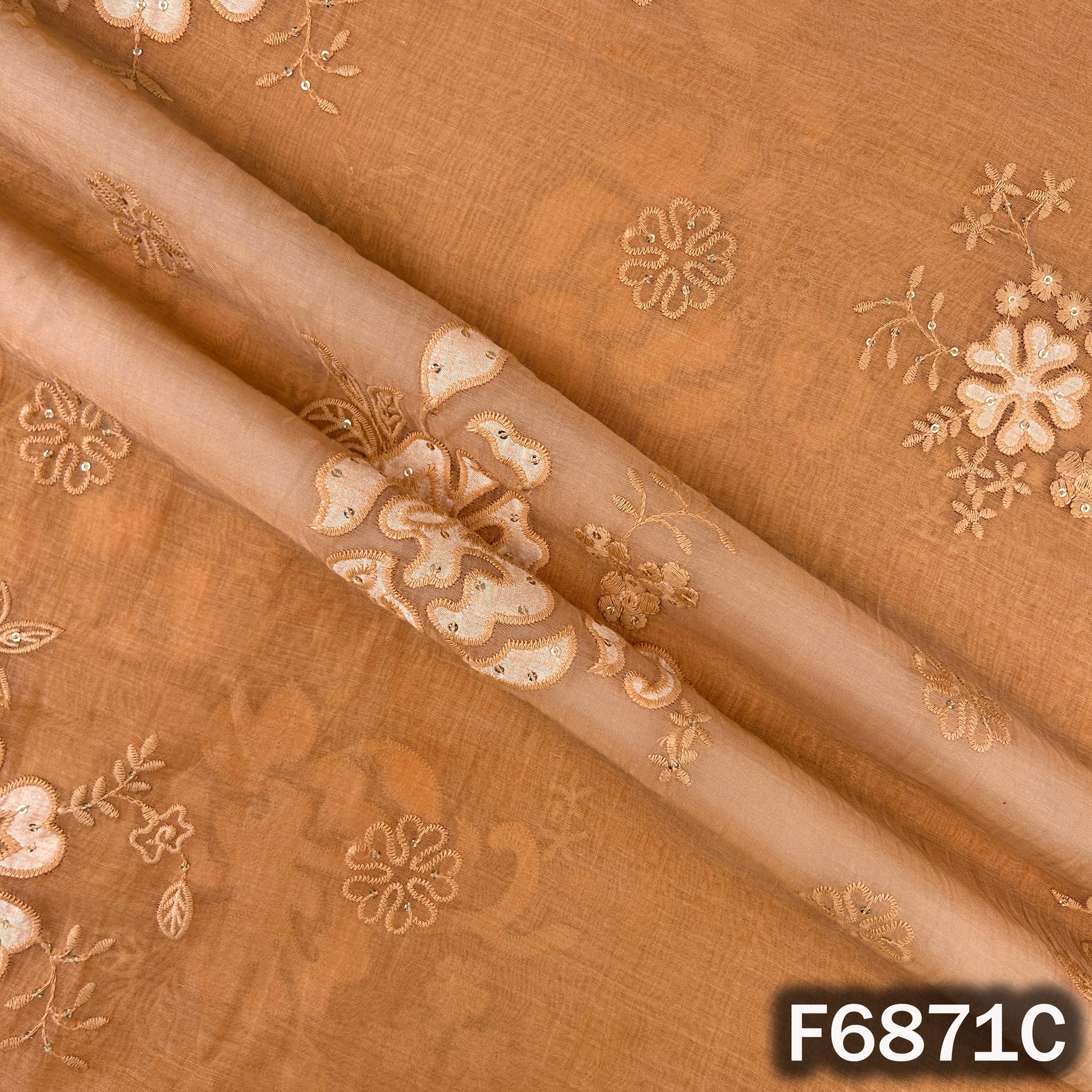 Close-up of orange Mul Chanderi fabric F6871C showing elegant thread sequins design