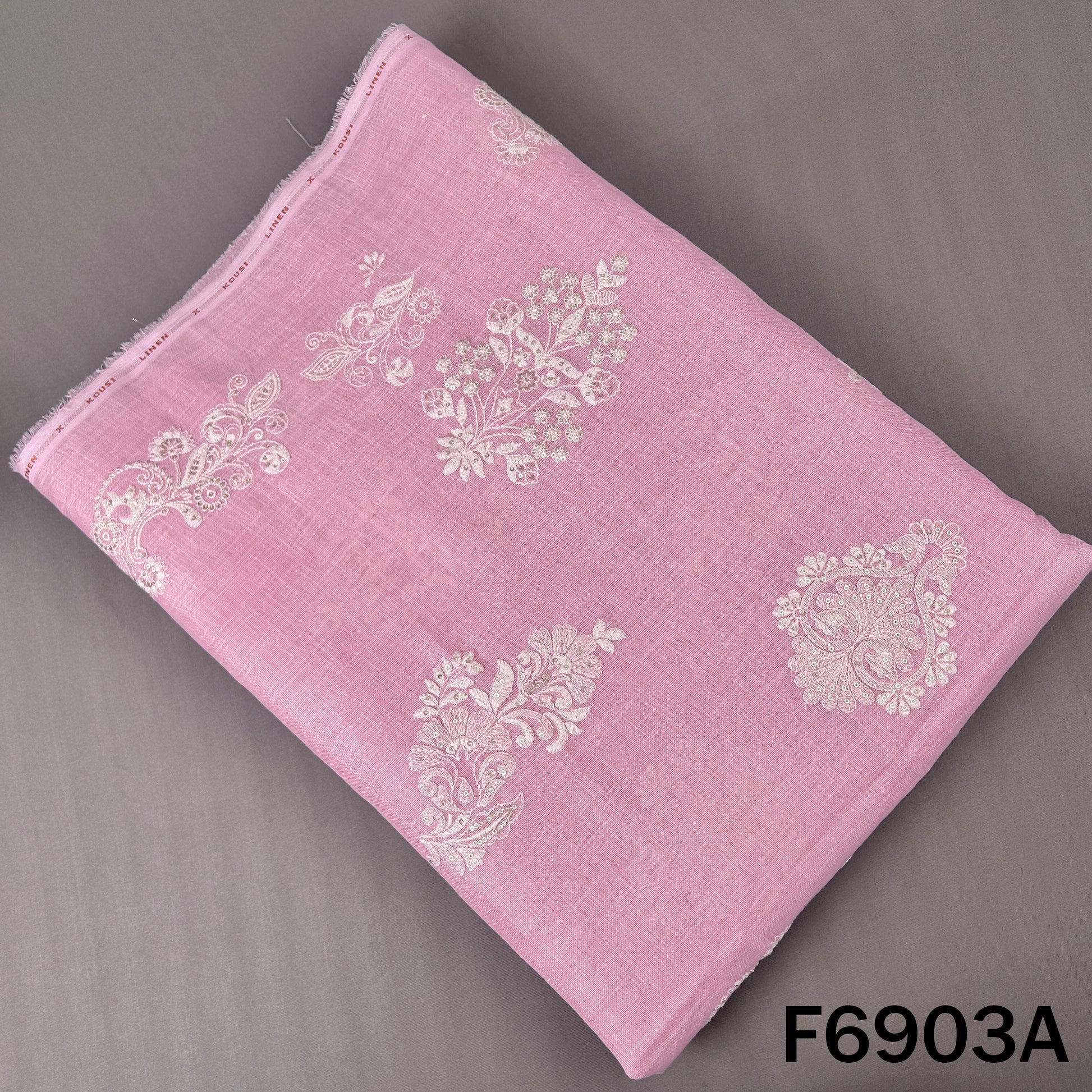 Soft pink linen fabric F6903A decorated with white floral thread work and subtle sequins
