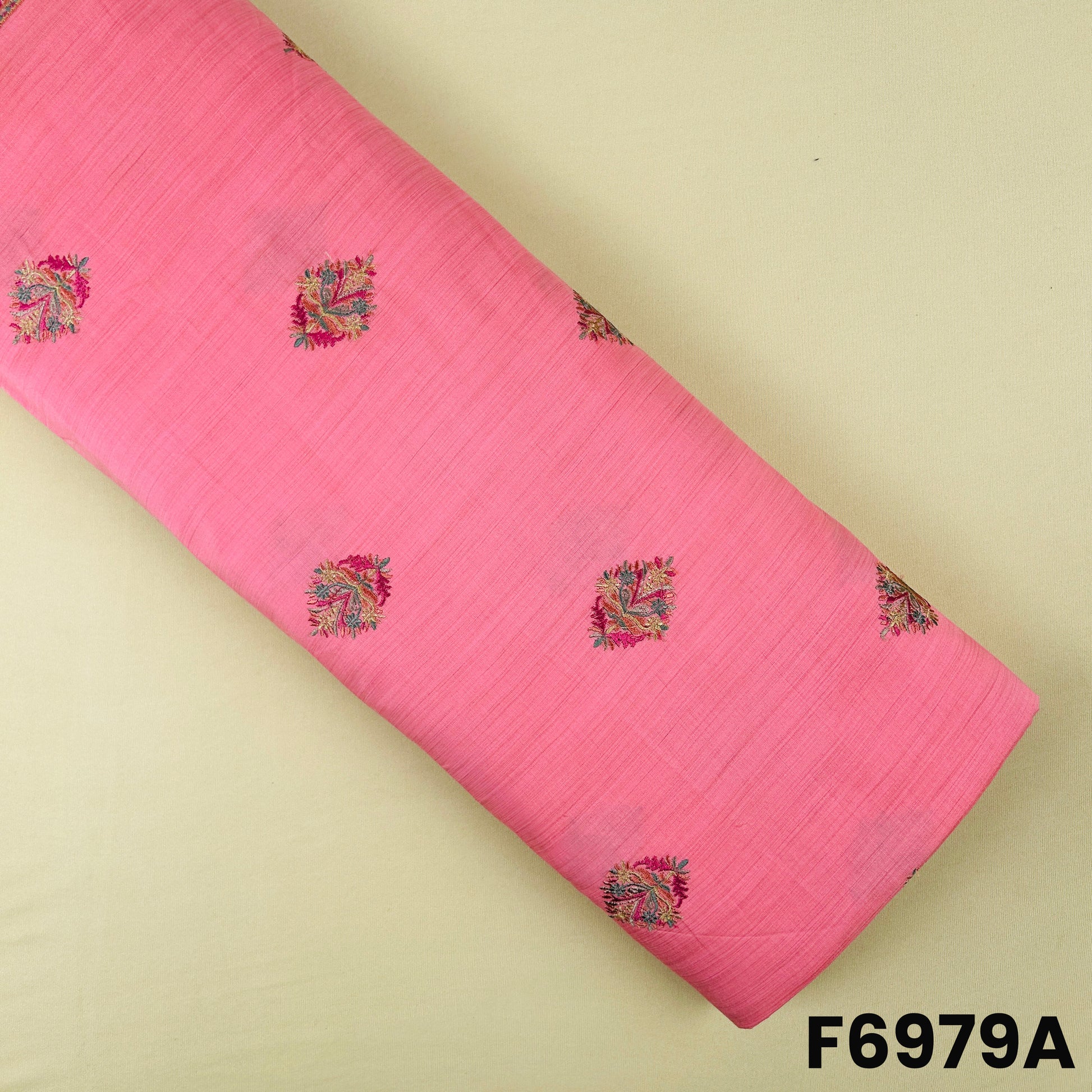 Pink semi silk fabric F6979A featuring small multicolor paisley embroidery on a soft textured base