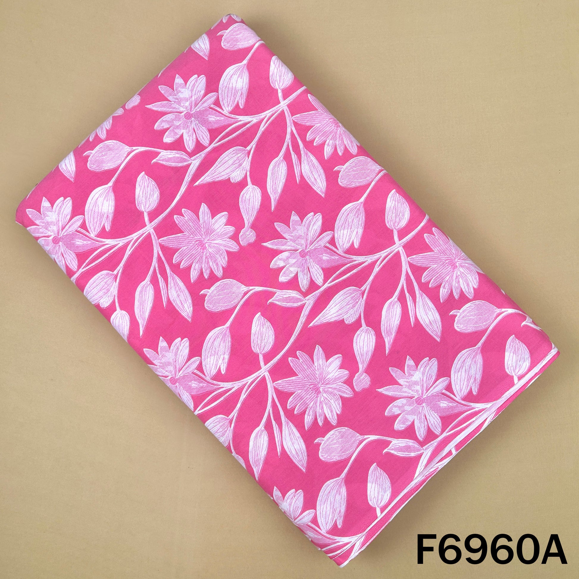 F6960A pink cotton fabric featuring bold white flower vines and leafy details for elegant outfits