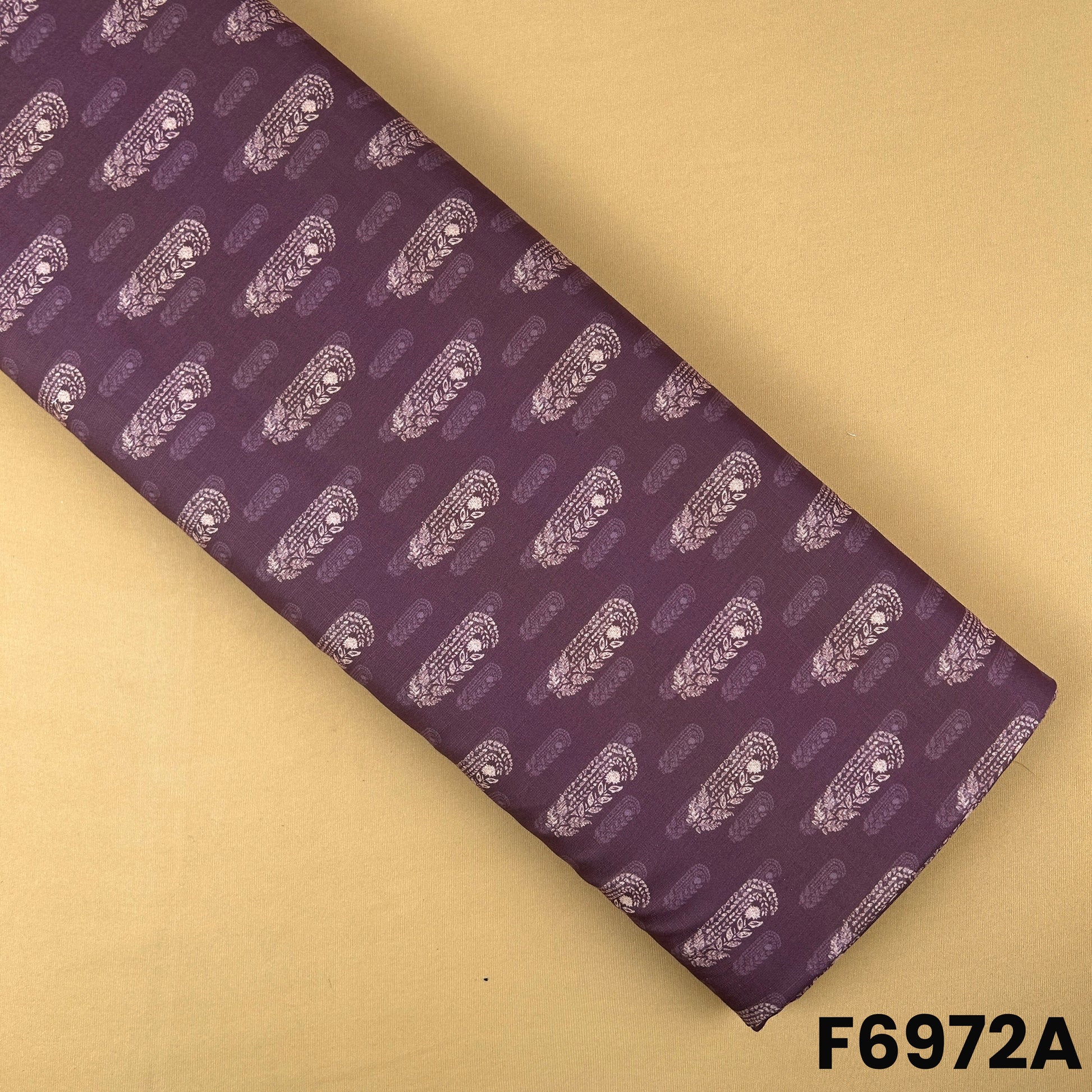 Plum Semi Linen fabric F6972A featuring small all-over paisley buta motifs on a rich solid base