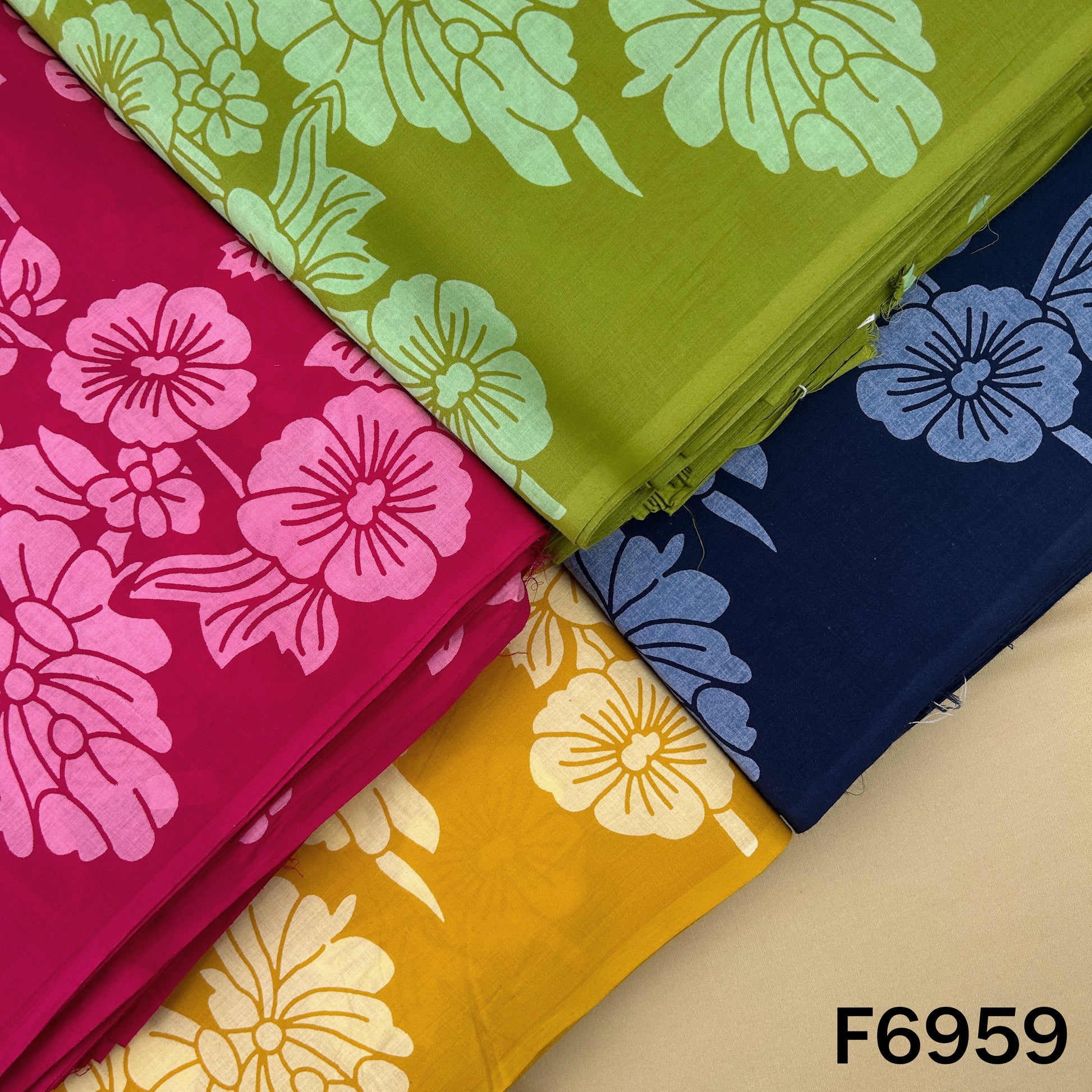 Printed Cotton fabric F6959 shown in pink, green, navy and mustard shades with bold floral artwork