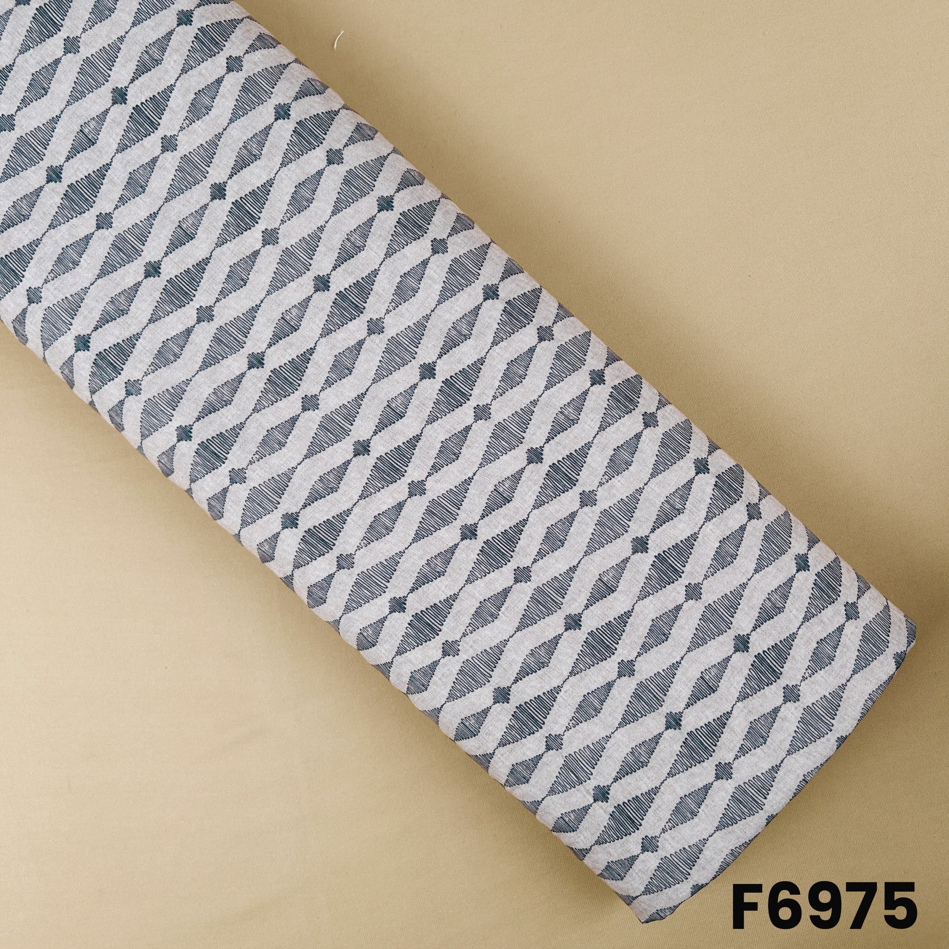Printed Semi Linen fabric F6975 with charcoal grey linear geometric motifs on a soft natural beige base