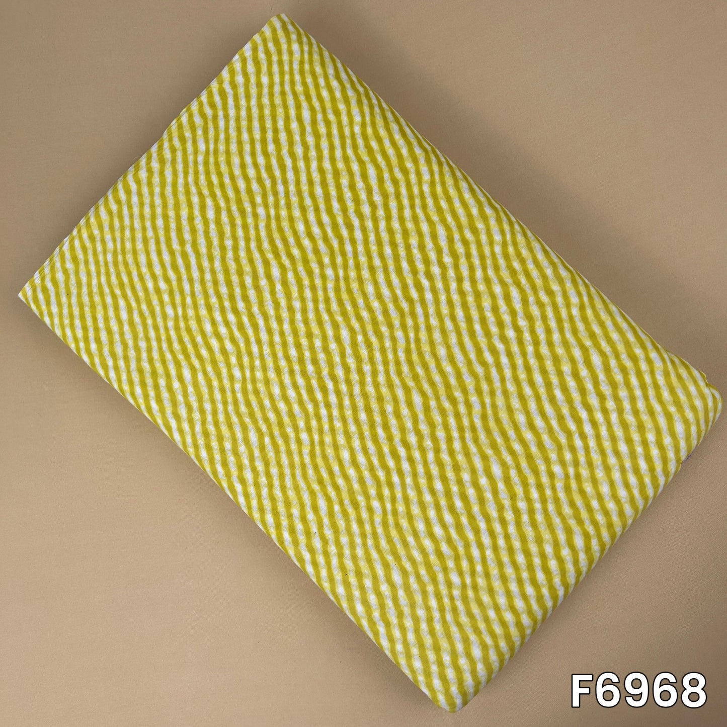 Mustard yellow printed cotton fabric F6968 with white hand-drawn wavy stripe pattern and soft breathable texture