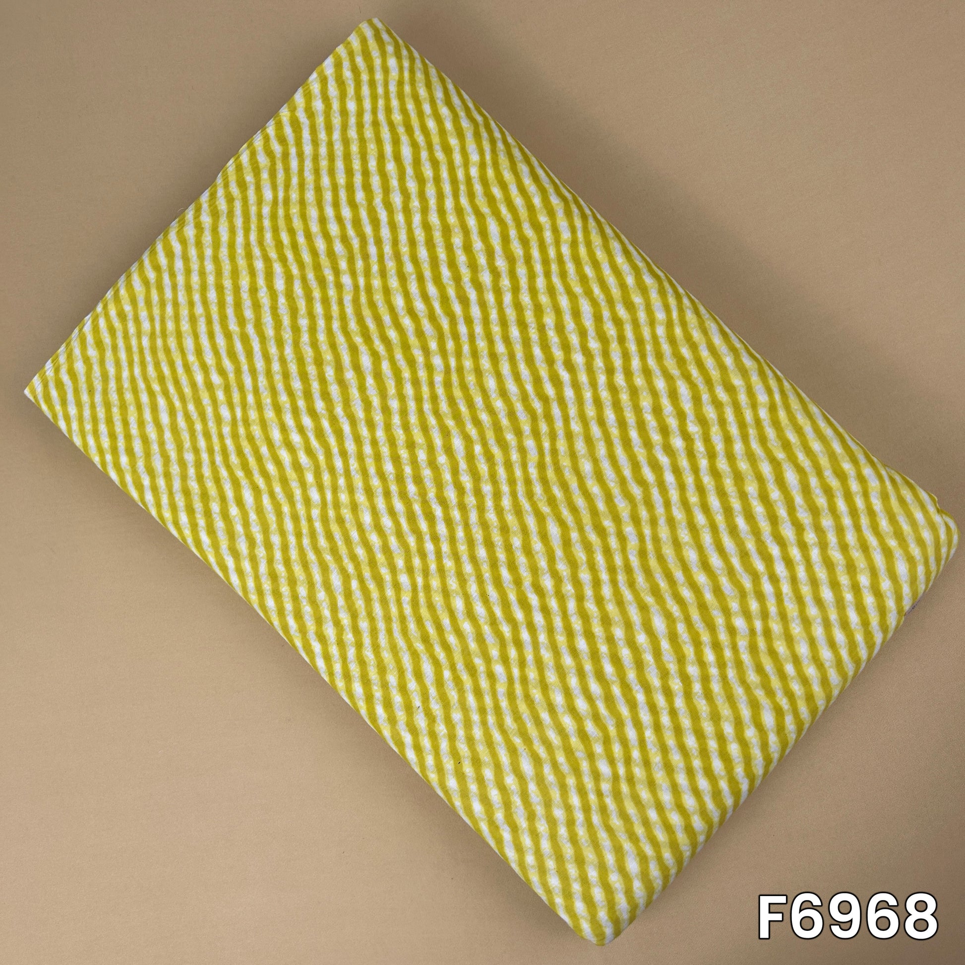 Mustard yellow printed cotton fabric F6968 with white hand-drawn wavy stripe pattern and soft breathable texture
