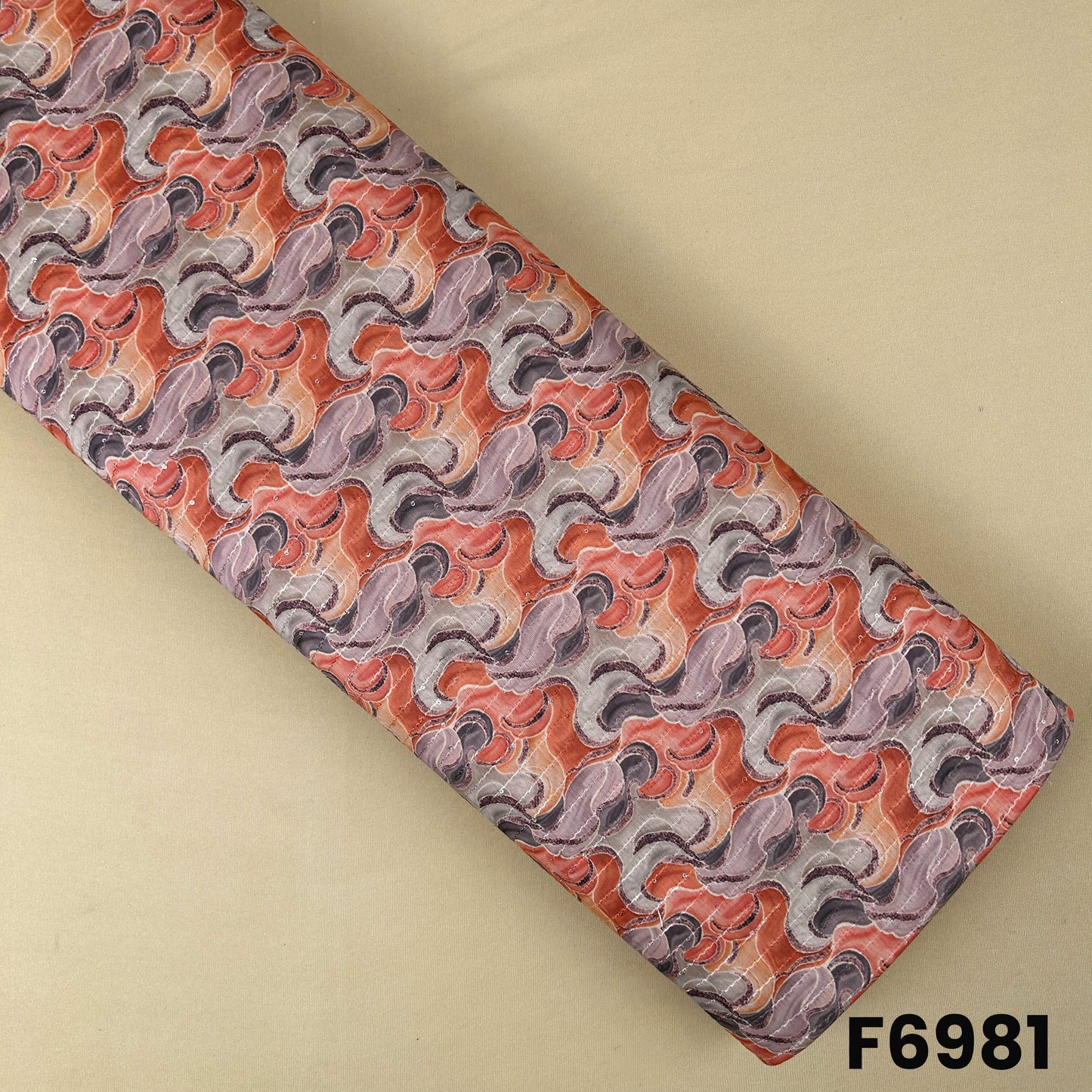 Semi silk fabric F6981 with abstract wave print in coral, peach, beige and taupe shades, enhanced with thread sequins detailing