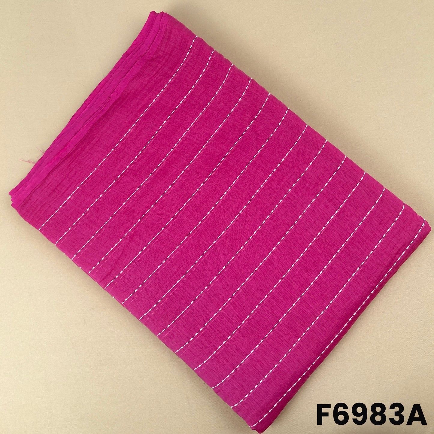 Rani pink Mul Chanderi fabric F6983A featuring fine vertical thread lines and a soft festive finish