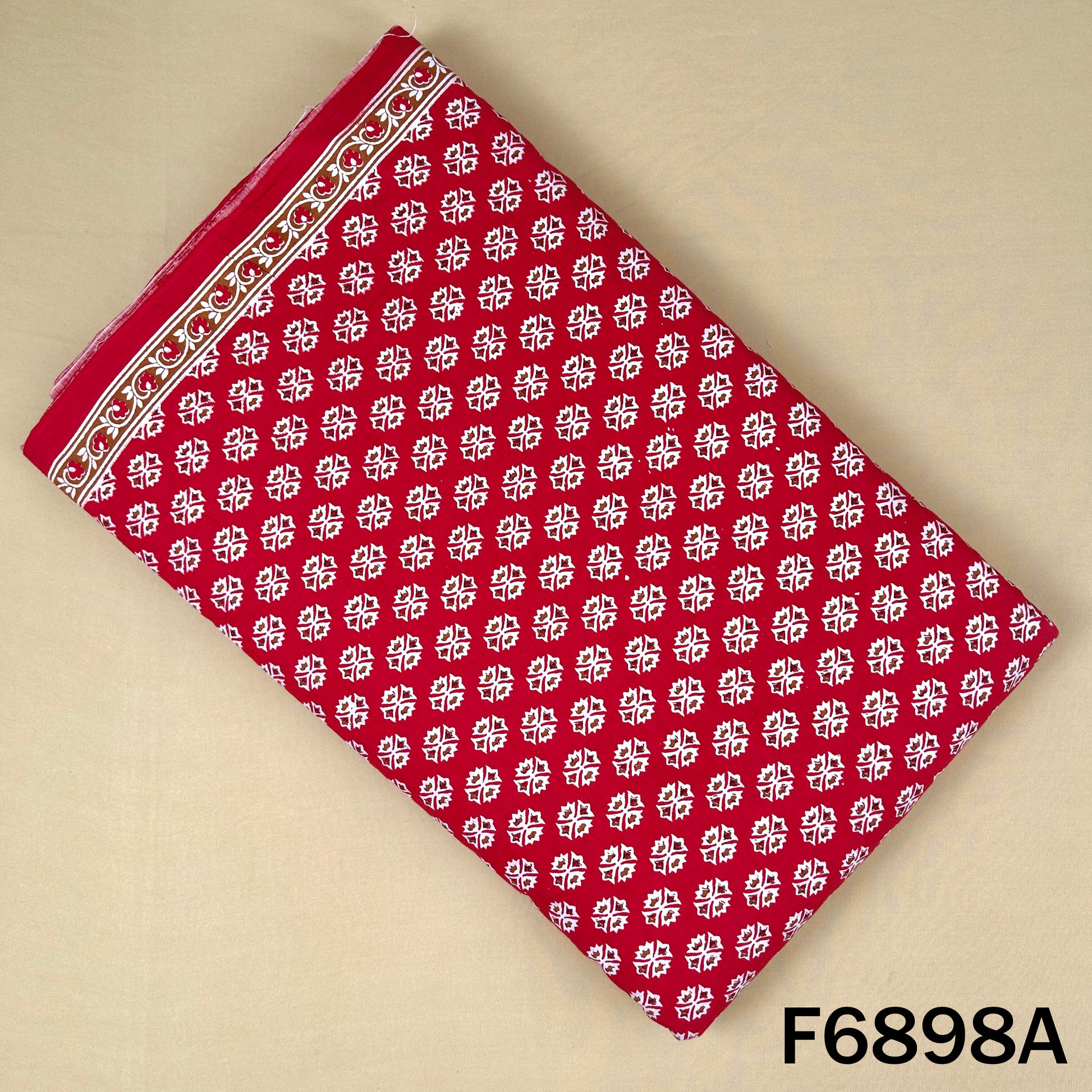 Red block print cotton fabric F6898A with small white ethnic motifs on a bright base