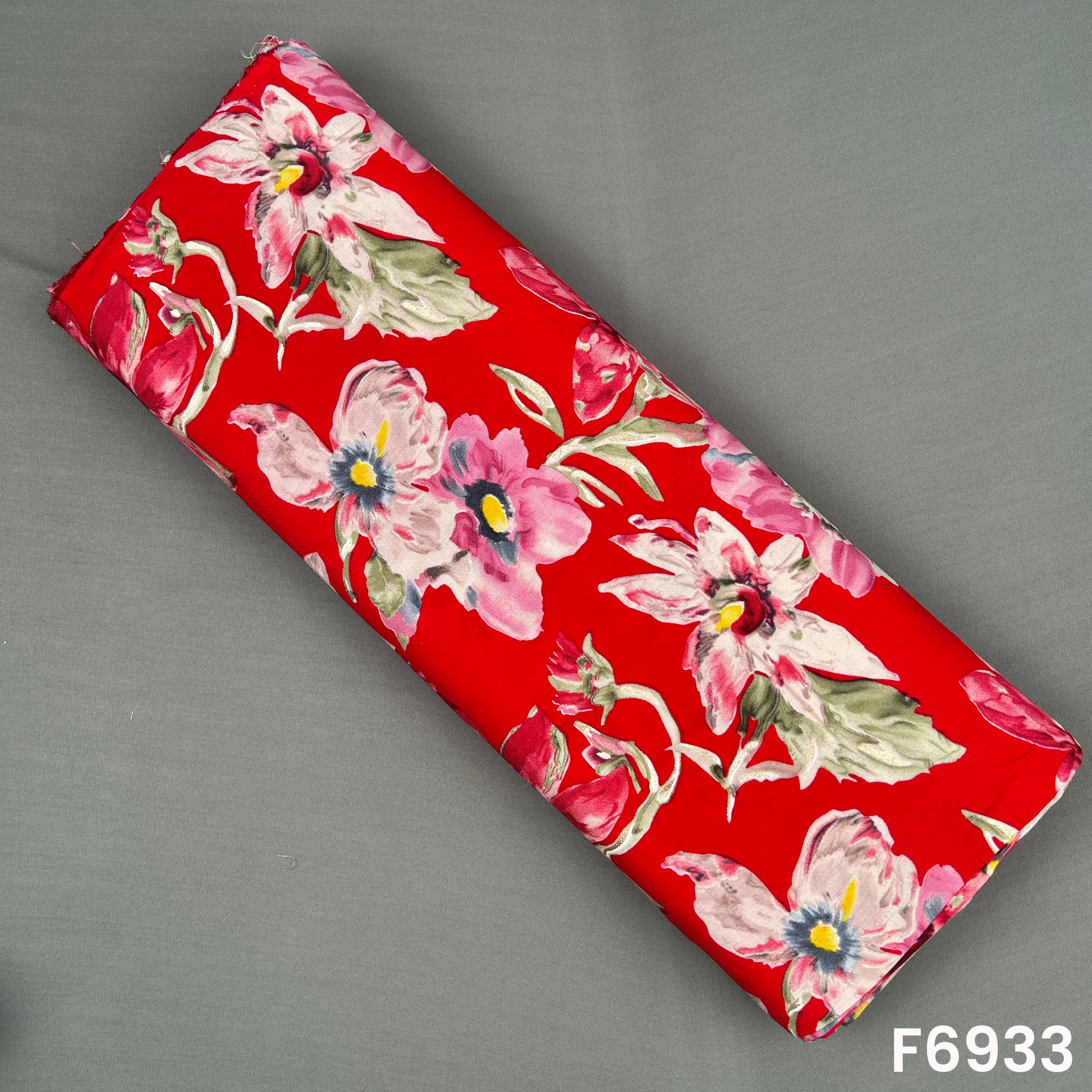Rich red foil print rayon fabric F6933 with watercolor-style flowers, soft leaves and golden shimmer highlights