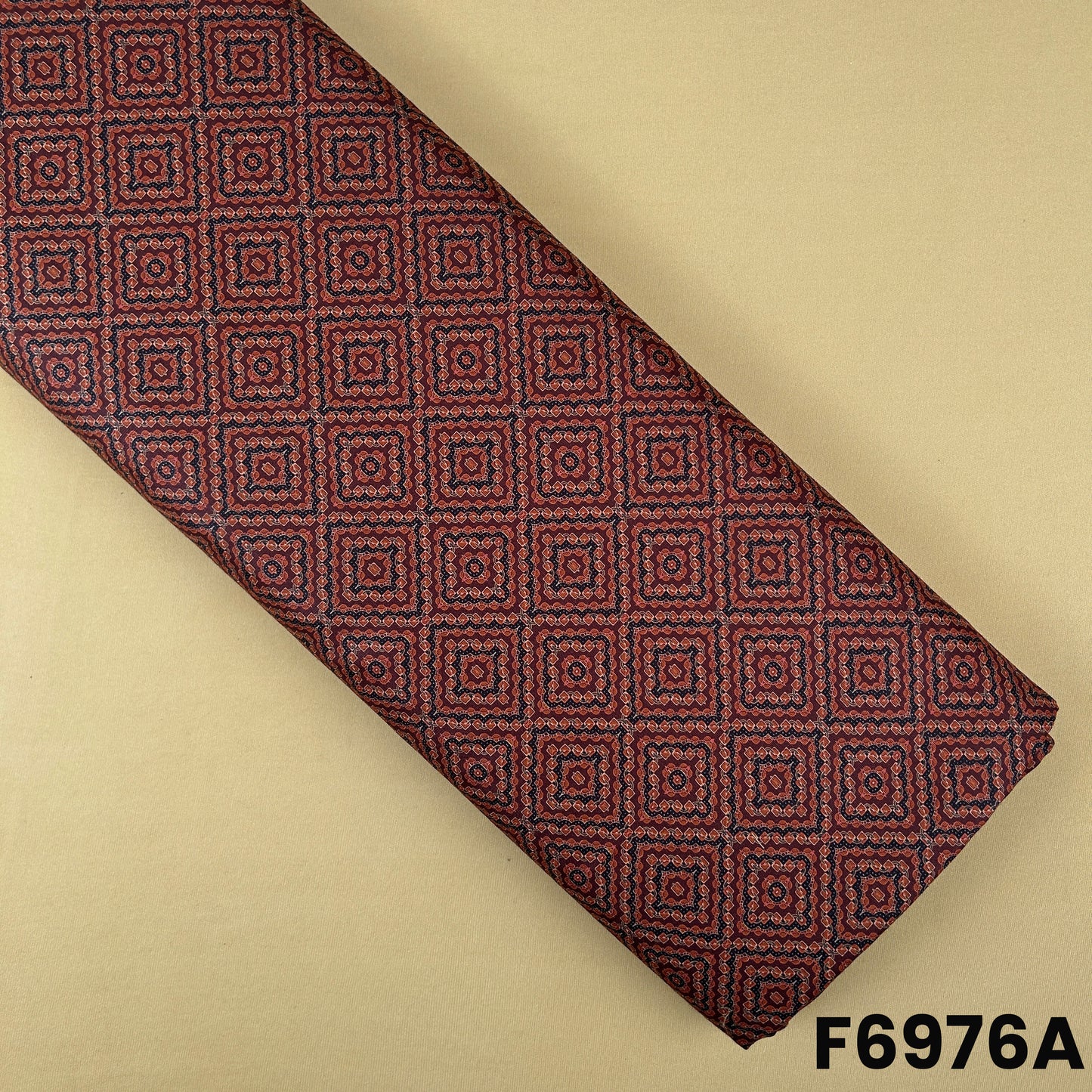 Rust Semi Linen fabric F6976A featuring small geometric square motifs with a classic ethnic look