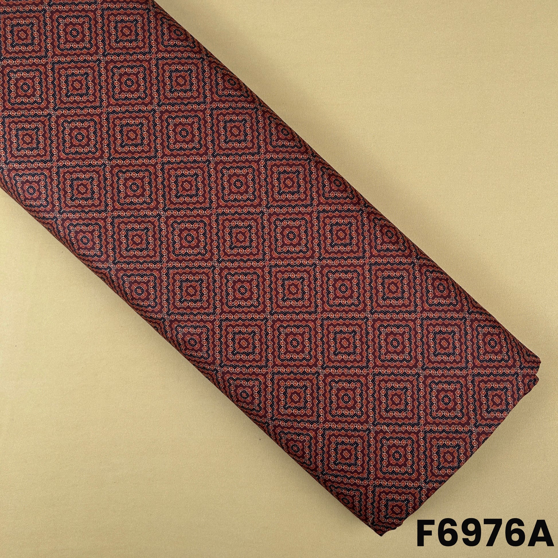 Rust Semi Linen fabric F6976A featuring small geometric square motifs with a classic ethnic look