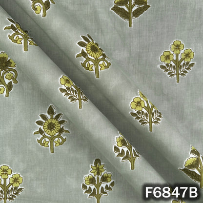Close-up folds and texture of sage green premium cotton fabric with floral design F6847B