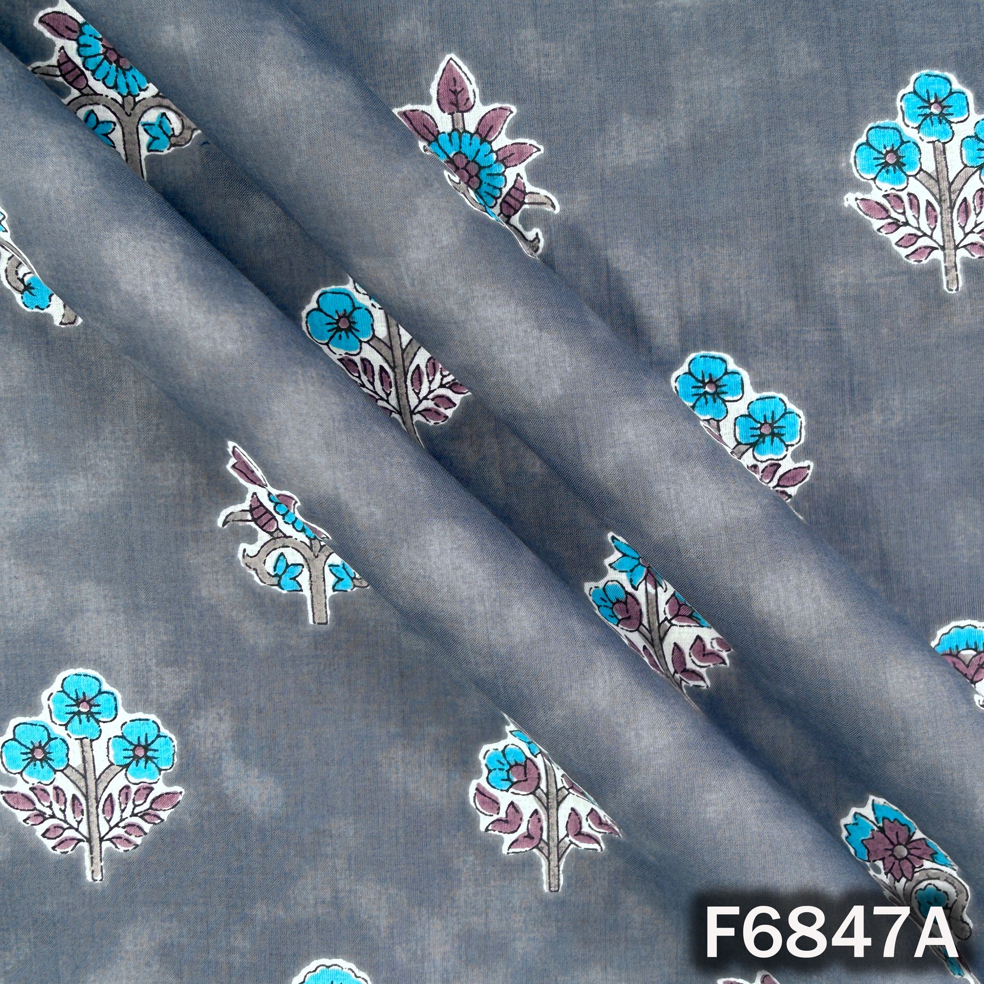 Close-up texture of slate blue premium cotton fabric with floral design F6847A