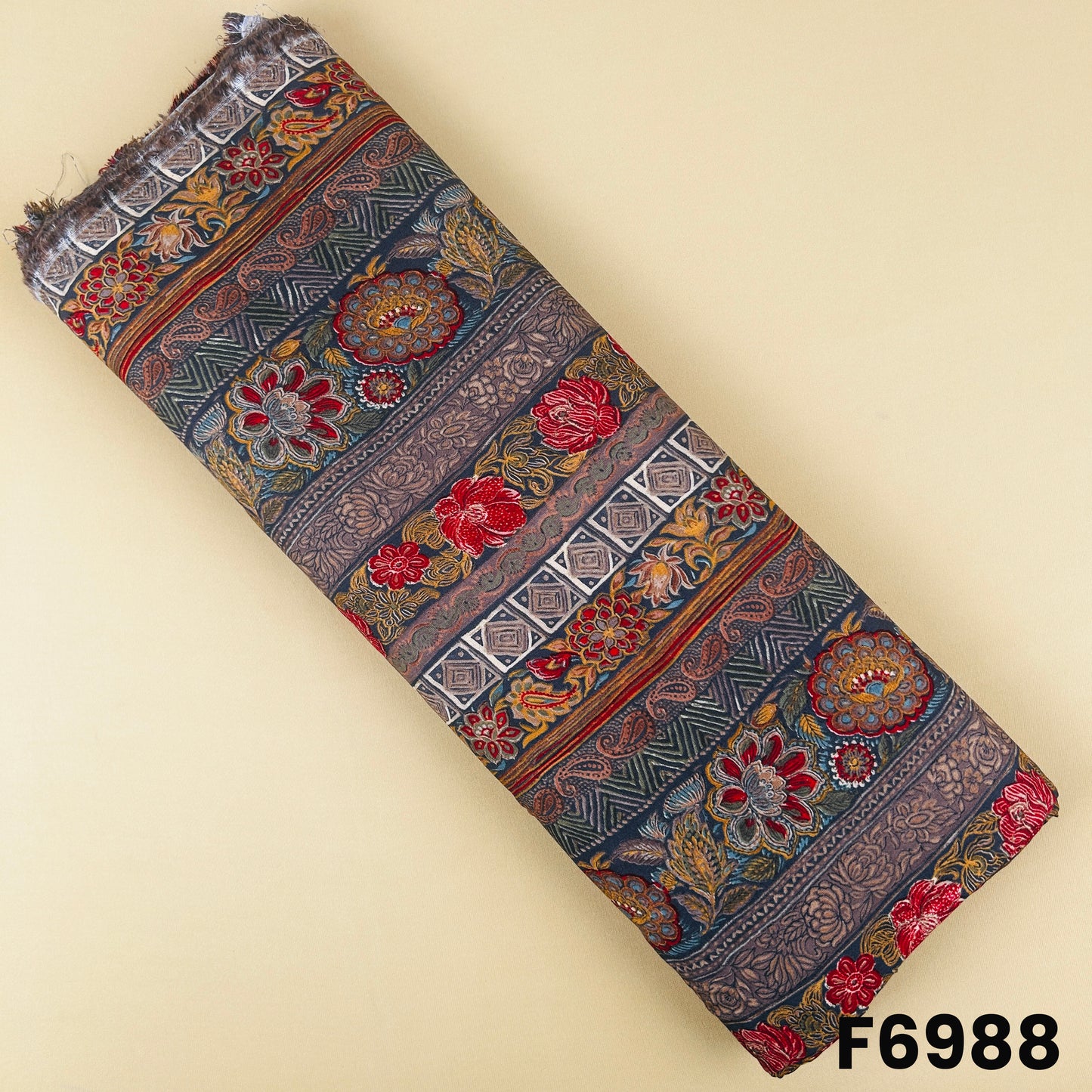 Earthy printed rayon fabric F6988 with floral motifs, paisley artwork and traditional stripe border design